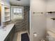 Clean bathroom with shower, toilet and floating shelves at 117 Mardon Ln, Statesville, NC 28677