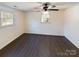 Spacious bedroom with dark laminate flooring and ceiling fan at 117 Mardon Ln, Statesville, NC 28677