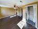Bedroom with dark laminate floors and walk-in closet at 117 Mardon Ln, Statesville, NC 28677