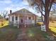 Charming ranch home with a covered porch and metal roof at 117 Mardon Ln, Statesville, NC 28677