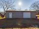 Metal garage with roll-up door and small window at 117 Mardon Ln, Statesville, NC 28677