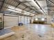 Spacious garage interior with shelving and workbench at 117 Mardon Ln, Statesville, NC 28677