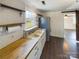 Kitchen with butcher block countertops and white cabinets at 117 Mardon Ln, Statesville, NC 28677