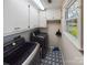 Bright laundry room with washer, dryer, and ample storage at 117 Mardon Ln, Statesville, NC 28677