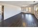 Spacious living area with dark laminate flooring at 117 Mardon Ln, Statesville, NC 28677