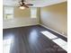 Living room with neutral walls and laminate flooring at 117 Mardon Ln, Statesville, NC 28677