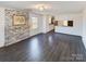 Living room with fireplace and dark laminate floors at 117 Mardon Ln, Statesville, NC 28677