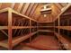 Unfinished attic space with wood beams and shelving at 1333 Carlton Ave, Charlotte, NC 28203