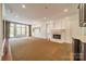 Finished basement with fireplace, built-ins, and hardwood floors at 1333 Carlton Ave, Charlotte, NC 28203