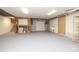 Unfinished basement with concrete floor, white walls and utility connections at 1333 Carlton Ave, Charlotte, NC 28203