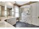 This bathroom features double vanities, a tiled walk-in shower, and elegant fixtures at 1333 Carlton Ave, Charlotte, NC 28203