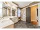 Spa-like bathroom with walk-in shower and white cabinetry at 1333 Carlton Ave, Charlotte, NC 28203