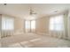Large bedroom with natural light, plush carpet, and light neutral paint color at 1333 Carlton Ave, Charlotte, NC 28203