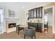 Dining area featuring a fireplace, elegant built-ins, and cozy seating for intimate gatherings at 1333 Carlton Ave, Charlotte, NC 28203