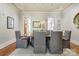 Formal dining room with hardwood floors, classic furniture, and ample natural light at 1333 Carlton Ave, Charlotte, NC 28203