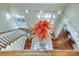 Grand foyer featuring a decorative chandelier, staircase, and hardwood floors at 1333 Carlton Ave, Charlotte, NC 28203