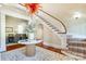 Elegant foyer featuring a curved staircase, marble table, and stylish chandelier at 1333 Carlton Ave, Charlotte, NC 28203