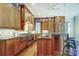 Well-equipped kitchen with wood cabinets, granite countertops and stainless steel appliances at 1333 Carlton Ave, Charlotte, NC 28203