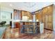 Gourmet kitchen with custom wood cabinetry, granite countertops, and stylish island seating at 1333 Carlton Ave, Charlotte, NC 28203
