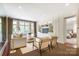 Comfortable living room with built-in cabinets and natural light from the French doors and windows at 1333 Carlton Ave, Charlotte, NC 28203