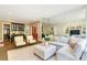 Bright living room with comfortable seating, a large mirror and a view to another living space at 1333 Carlton Ave, Charlotte, NC 28203
