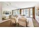 Bright living room with French doors, comfortable seating, and an elegant decorative rug at 1333 Carlton Ave, Charlotte, NC 28203