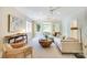Spacious living room with a decorative ceiling fan and a view to the exterior at 1333 Carlton Ave, Charlotte, NC 28203