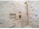 Large shower with marble tile and gold fixtures at 1333 Carlton Ave, Charlotte, NC 28203