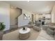 Open living space with a staircase, and a view into the kitchen area at 1515 Harper Landing Blvd, Stanley, NC 28164