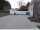 Long concrete driveway leading to two-car garage at 1601 Eden Glen Dr, Dallas, NC 28034