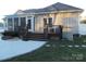 Back of house with deck, hot tub, and screened porch at 1601 Eden Glen Dr, Dallas, NC 28034