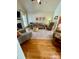 Spacious living room featuring hardwood floors, a cozy seating area, and a vaulted ceiling at 1601 Eden Glen Dr, Dallas, NC 28034
