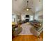 Bright living room with a fireplace, neutral furniture, and ample natural light at 1601 Eden Glen Dr, Dallas, NC 28034