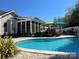 Inviting pool area with deck, lounge chairs, and screened-in porch, ideal for summer entertainment and relaxation at 1601 Eden Glen Dr, Dallas, NC 28034