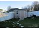 Tan vinyl storage shed with ramp access at 1601 Eden Glen Dr, Dallas, NC 28034