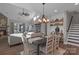 Open dining area with a farmhouse-style table and chandelier at 163 Paradise Hills Cir, Mooresville, NC 28115