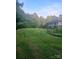 Expansive backyard featuring lush greenery, perfect for outdoor activities and relaxation at 16415 Capps Rd, Charlotte, NC 28278