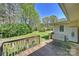 Wide backyard with a wood deck, well-kept lawn, and mature landscaping, perfect for outdoor activities at 16415 Capps Rd, Charlotte, NC 28278