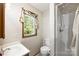 Bright bathroom with a window, shower, and modern fixtures, offering a clean and functional space at 16415 Capps Rd, Charlotte, NC 28278