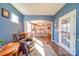 Relaxing sunroom with leather armchairs and access to a patio at 205 Picasso Trl, Mount Holly, NC 28120