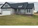Charming home with a well-manicured lawn, two car garage and inviting porch at 208 Beths Ct # 35, York, SC 29745
