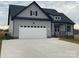 Charming gray two-story home featuring a spacious two-car garage and landscaped front yard at 208 Beths Ct # 35, York, SC 29745
