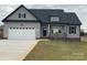Charming gray two-story home featuring a spacious two-car garage and landscaped front yard at 208 Beths Ct # 35, York, SC 29745