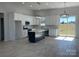 Modern kitchen with white cabinets, large island, and stainless steel appliances at 208 Beths Ct # 35, York, SC 29745