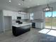 Modern kitchen with white cabinets, large island, and stainless steel appliances at 208 Beths Ct # 35, York, SC 29745