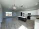 Modern kitchen with white cabinets, large island, and stainless steel appliances at 208 Beths Ct # 35, York, SC 29745