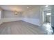 Bright dining room with updated light fixture and wood-look floors at 2208 Pennick Ct, Harrisburg, NC 28075