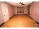 Simple bedroom with hardwood floors and neutral walls at 2913 & 2901 Wesleyan Church Rd, Lincolnton, NC 28092