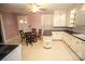 Eat-in kitchen with white cabinets and a peninsula counter at 2913 & 2901 Wesleyan Church Rd, Lincolnton, NC 28092