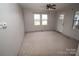 Bright living room with neutral carpeting at 2913 & 2901 Wesleyan Church Rd, Lincolnton, NC 28092